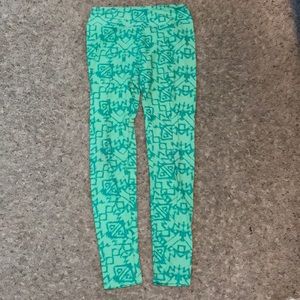 Light green leggings with dark green patterns.